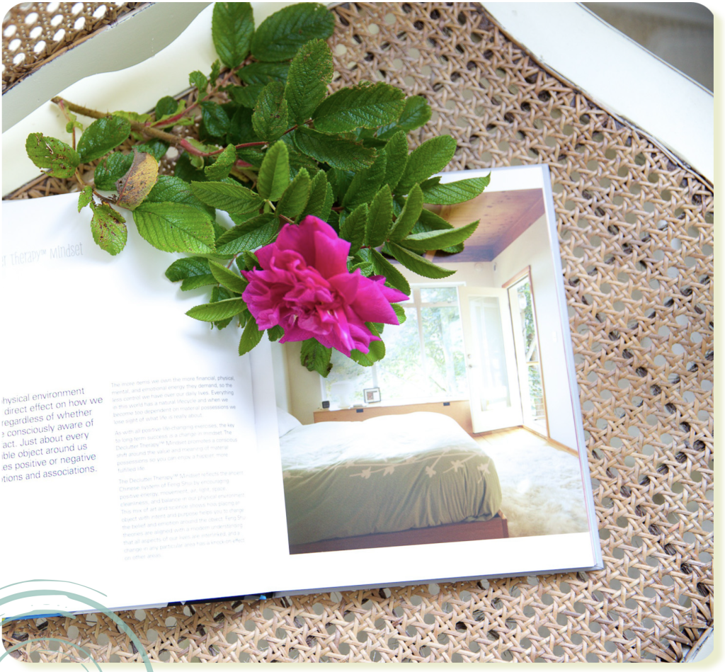 declutter specialist book open page with fresh flower on a wicker chair for home decor, image by Vig Gleeson Irish personal brand photographer copyright