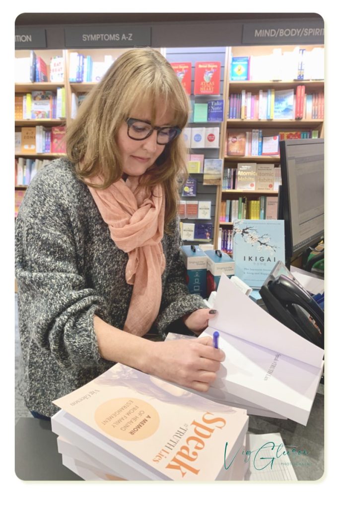 Photo of me signing my memoir, Speak #TRUTH Lies in O'Mahony's Vig Gleeson  Personal brand photography Ireland