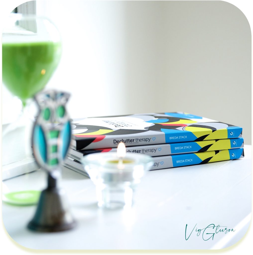 Photograph of The Declutter Therapy book by Breda Stack with green personal brand prop elements, photographed by Vig Gleeson Irish personal brand photographer copyright